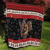 Krampus Christmas quilt blanket with red patterned top band and black snowflake diamond base