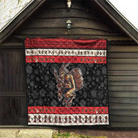 Krampus Christmas quilt blanket hanging indoors with red stripes, black snowflake pattern, monster art