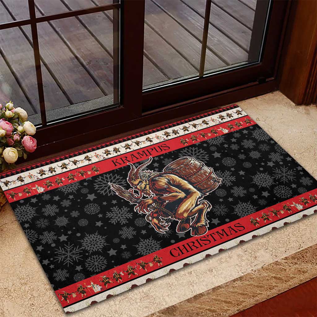 Black outdoor doormat with red border stripes, snowflakes, and Krampus graphic