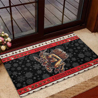 Black outdoor doormat with red border stripes, snowflakes, and Krampus graphic