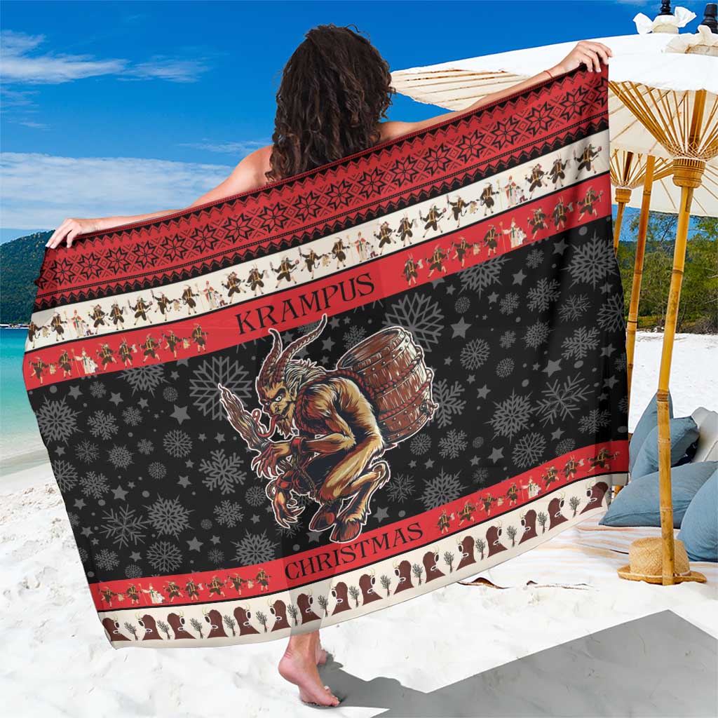 Krampus Christmas sarong, black with red trim, snowflake pattern and central monster print