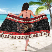 Krampus Christmas sarong (back view), black base with red border, snowflakes and Krampus art