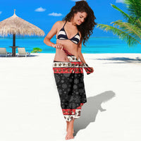 Krampus Christmas sarong with red trim, white reindeer band, and black snowflake fabric
