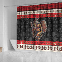 Christmas shower curtain with central horned demon holding a barrel and festive strip border