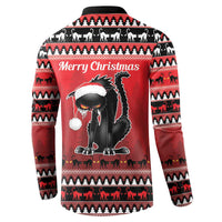 Red sweatshirt with black cat graphic and “Merry Christmas” text on the back, fair isle pattern