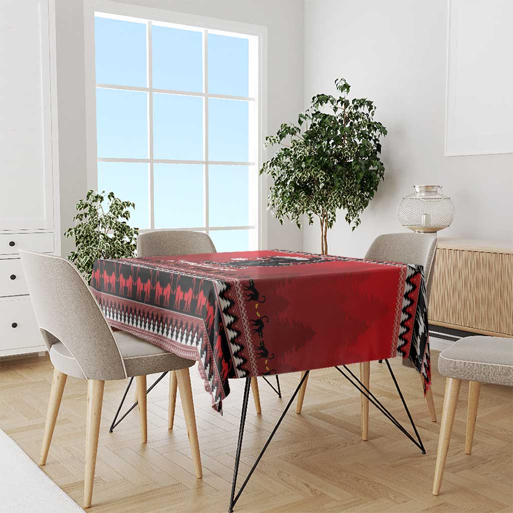 Red Christmas tablecloth with black cat silhouette print and jagged pattern edge