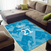 Blue cricket area rug with lion crest, custom text, and '21' geometric pattern