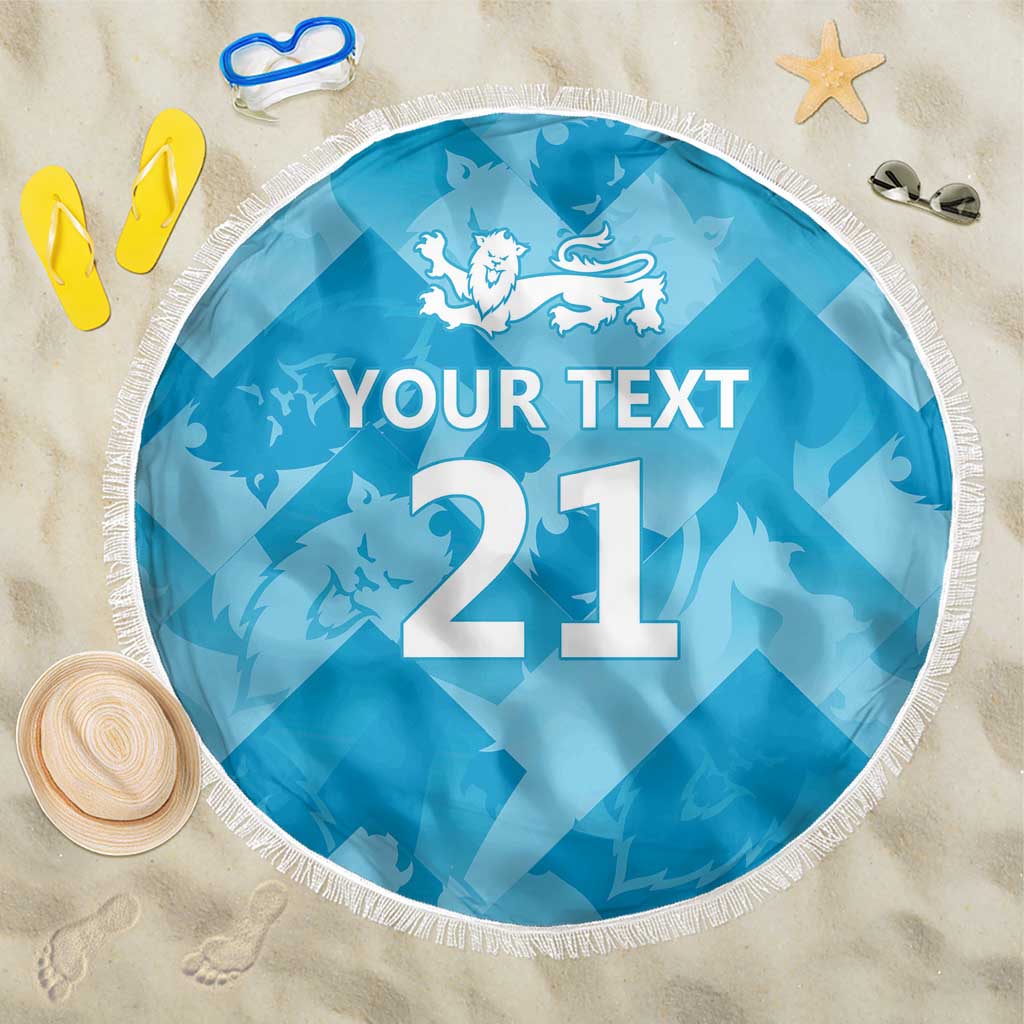Blue round beach blanket with tassel fringe, lion crest and large '21' with 'YOUR TEXT'.