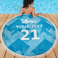 Blue round beach blanket with tassel fringe, lion crest and '21' with 'YOUR TEXT' on deck.