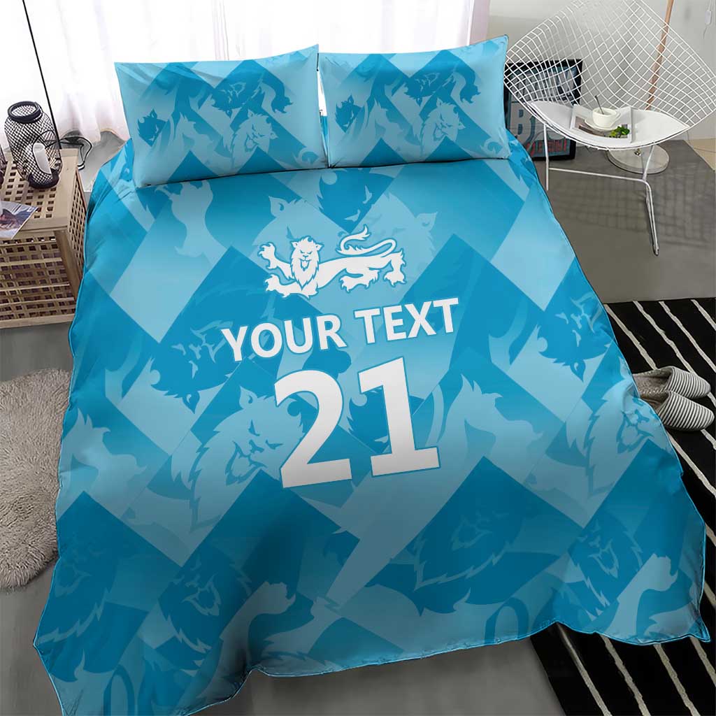 Blue duvet cover with “YOUR TEXT 21” and lion emblem, with two matching pillowcases
