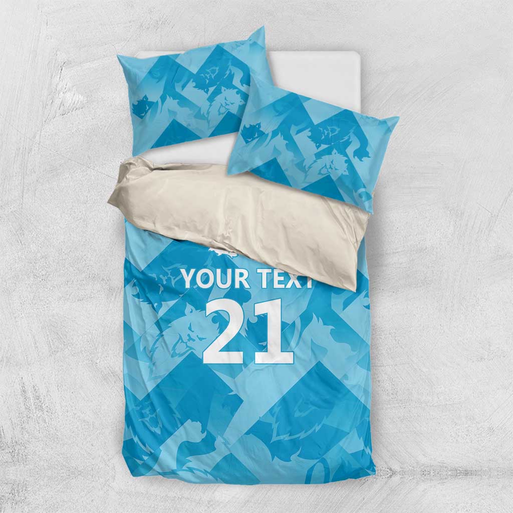 Blue bedding set with “YOUR TEXT 21” design and lion crest on duvet and pillows