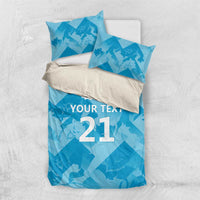Blue bedding set with “YOUR TEXT 21” design and lion crest on duvet and pillows