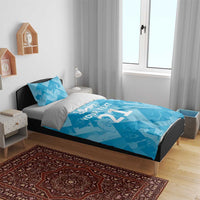 Blue duvet cover and pillows with “YOUR TEXT 21” print and lion emblem