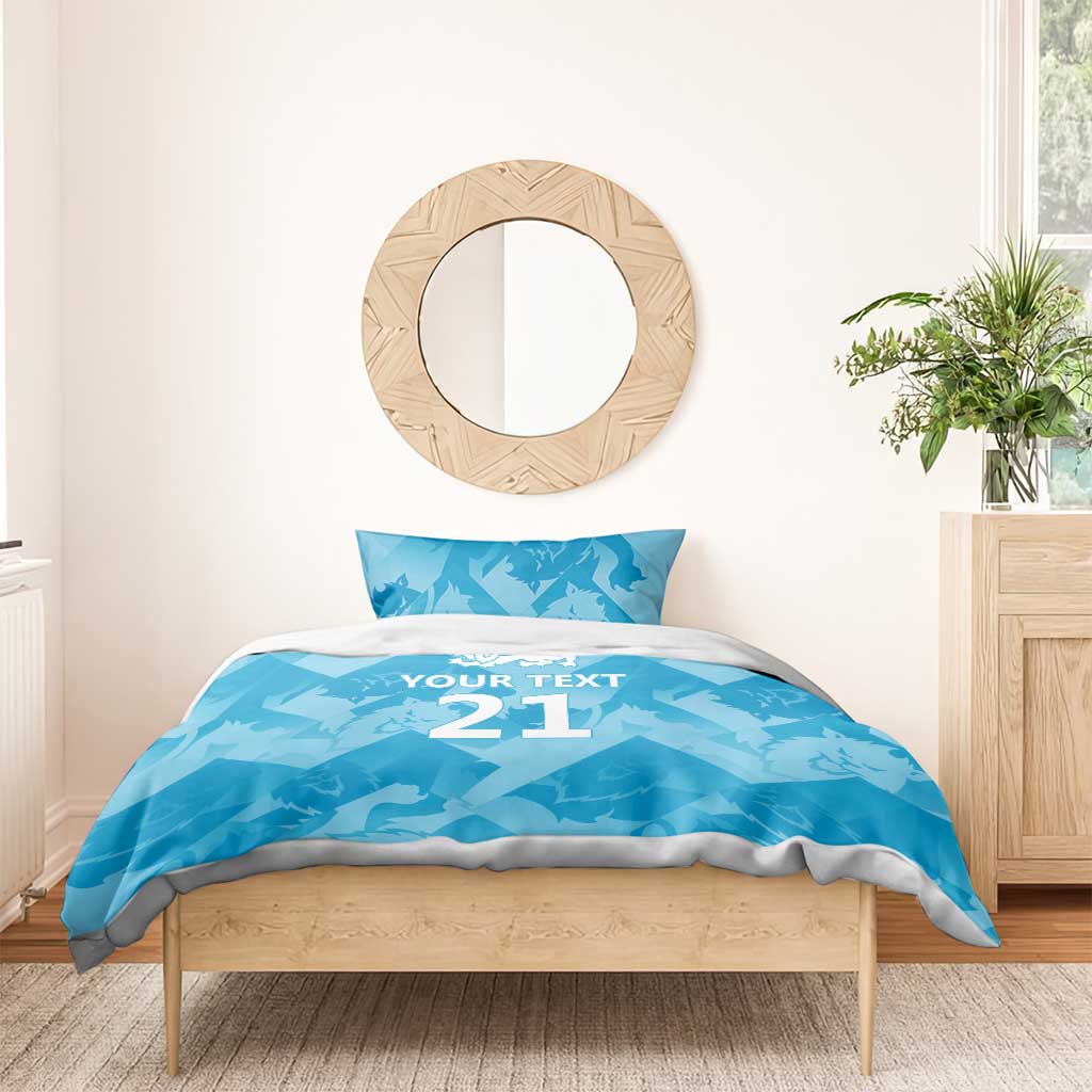 Blue bedding set with “YOUR TEXT 21” design and lion crest on duvet and pillow