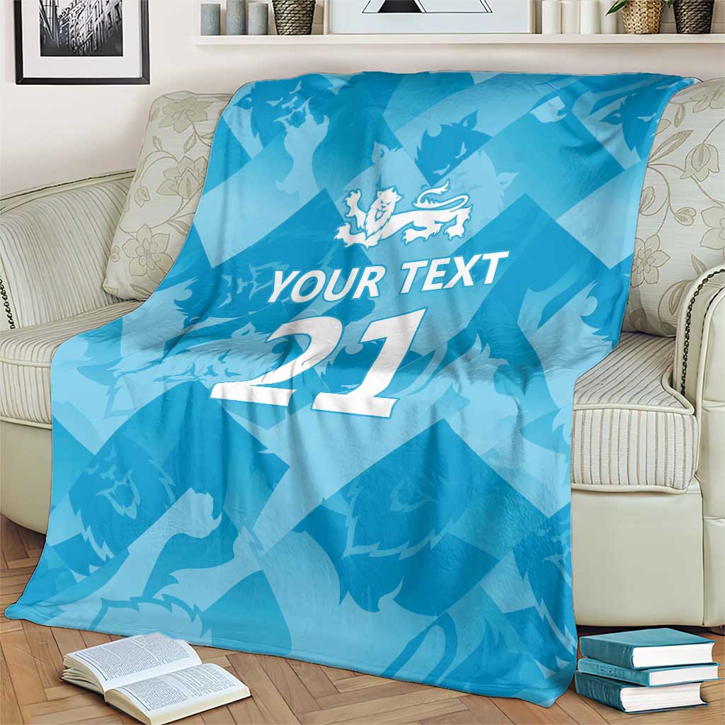 Blue custom cricket blanket on chair with lion emblem, 'YOUR TEXT', and number 27