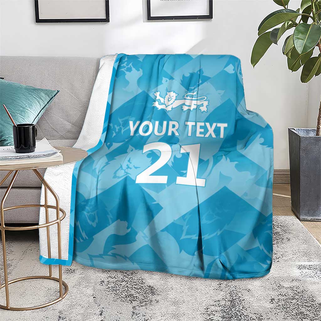 Blue custom cricket blanket on floor with lion emblem, 'YOUR TEXT', and number 21