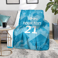 Blue custom cricket blanket on floor with lion emblem, 'YOUR TEXT', and number 21