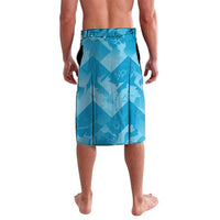 Blue geometric lavalava-style shorts with elastic waistband and side slit, back view