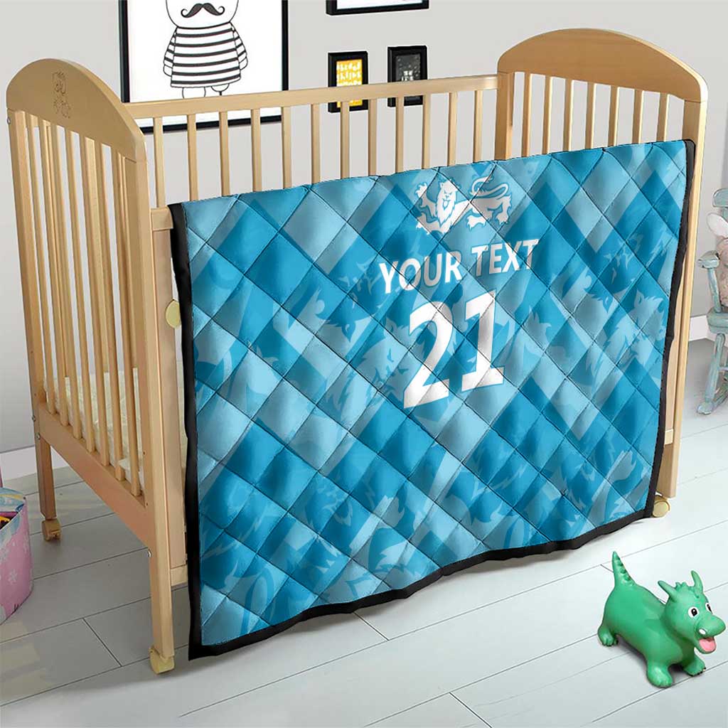 Blue diamond-quilted baby blanket with white lion crest, “YOUR TEXT” and “21”.