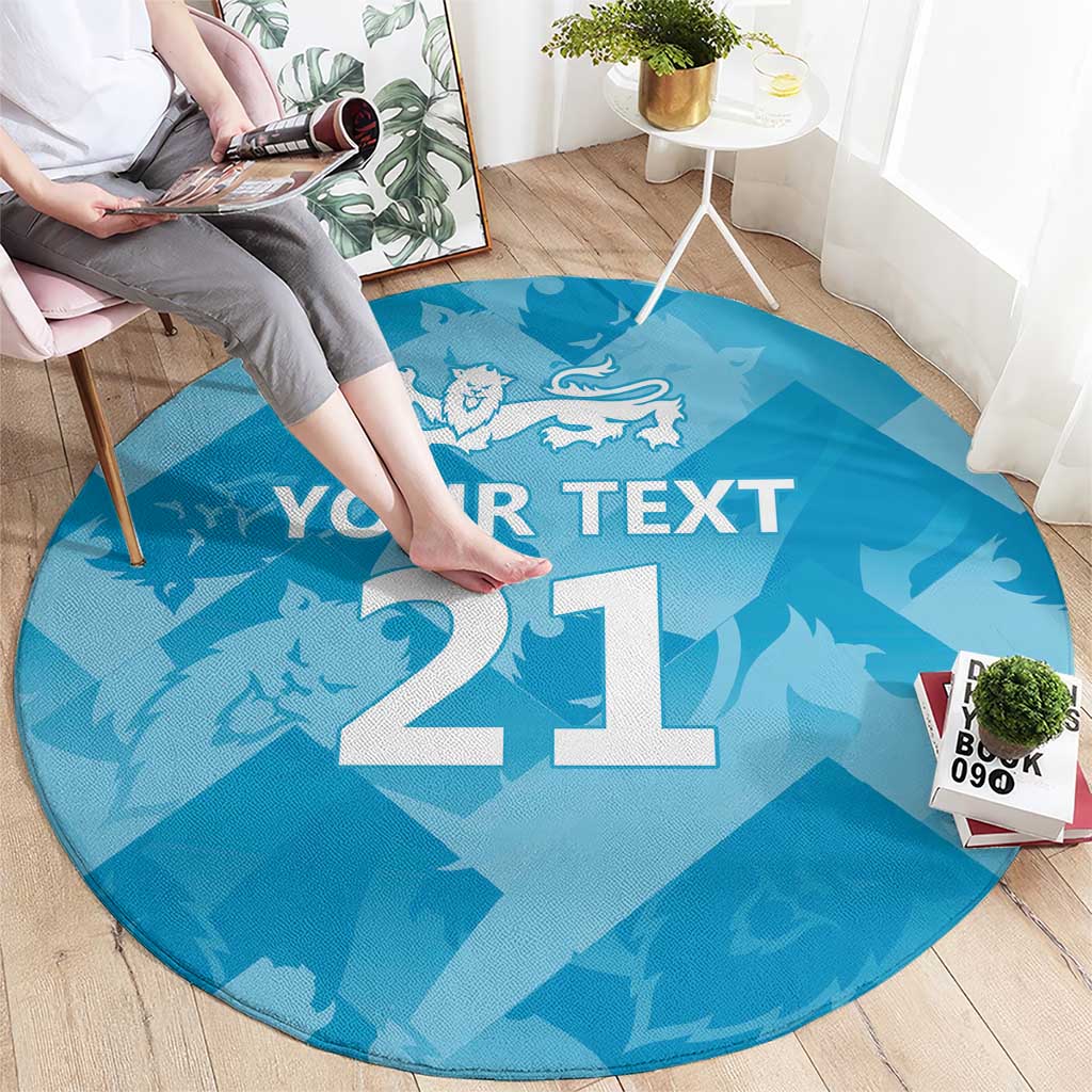 Round blue rug with white '21' and lion graphic; text 'YOUR TEXT' visible