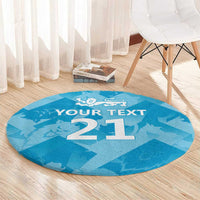 Round blue round rug with white '21' and lion crest; 'YOUR TEXT' text in center
