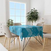 Blue patterned tablecloth with lion silhouettes on a dining table and chairs