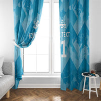Blue window curtains with lions crest, custom text, and a gathered side seam.