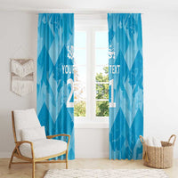 Blue window curtain panels with lions crest and custom text, styled in a room.