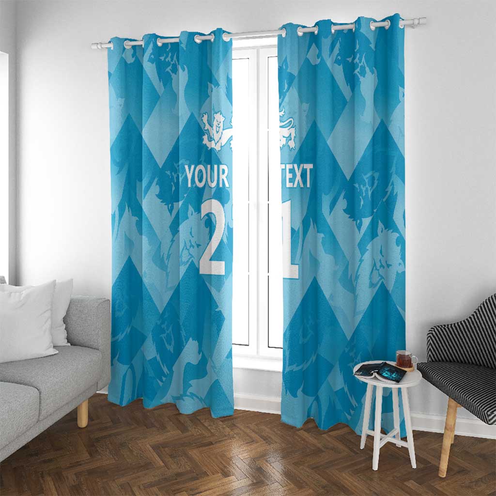 Blue window curtain panels with lions crest and custom text on a zigzag background.