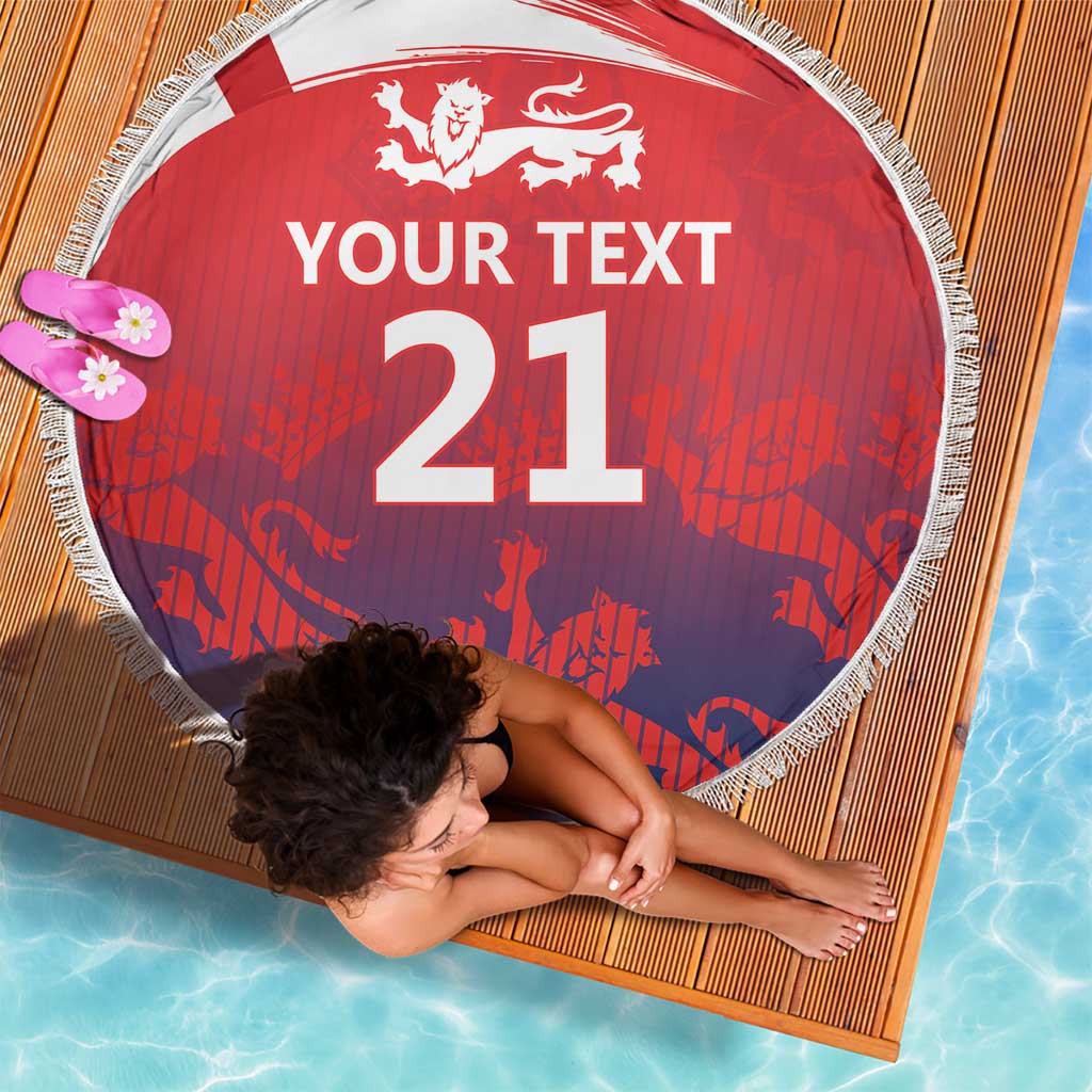 Red round beach blanket with fringe, lion crest and “YOUR TEXT 21” centered