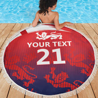 Round beach blanket with fringe, red and navy pattern, lion crest and “YOUR TEXT 21”
