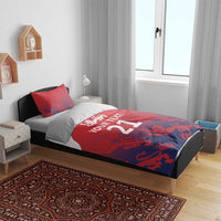 Red and blue duvet and pillow set on bed, 'Your Text 21' design
