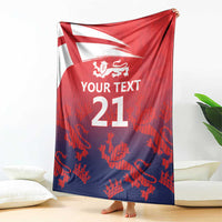 Red and dark blue cricket blanket draped with England flag, lion crest and '21'