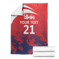 Folded red cricket blanket with England flag, lion crest and '21' display