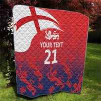 Red and navy quilt featuring Union Jack, lion crest, and 'YOUR TEXT 21' on quilted diamonds