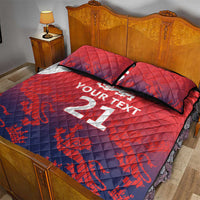 Red and blue quilt bed set with custom text on duvet and lions emblem, 2 pillowcases