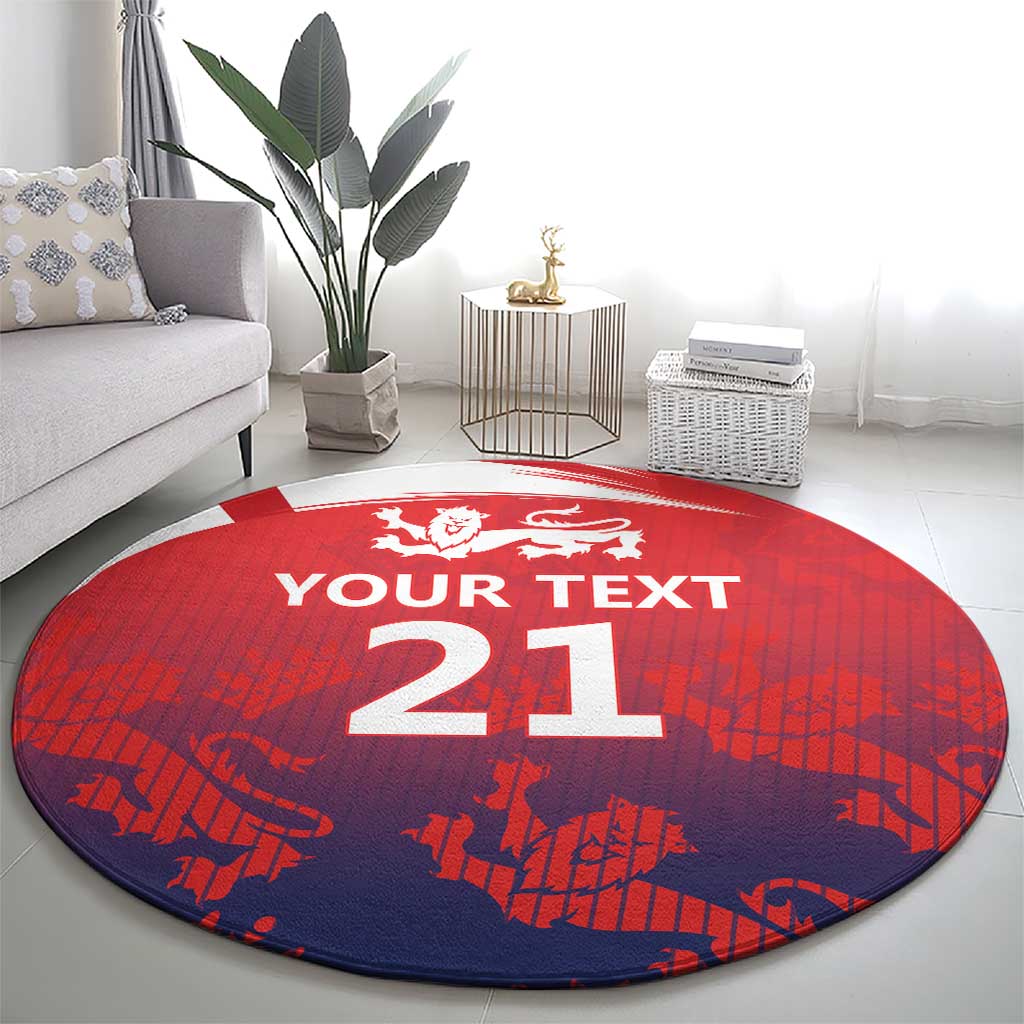 Red and navy round cricket rug with white crest and large '21' in the center