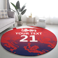 Red and navy round cricket rug with white crest and large '21' in the center