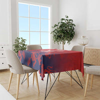 Red and navy cricket tablecloth with lion crest and flag-style pattern on dining table
