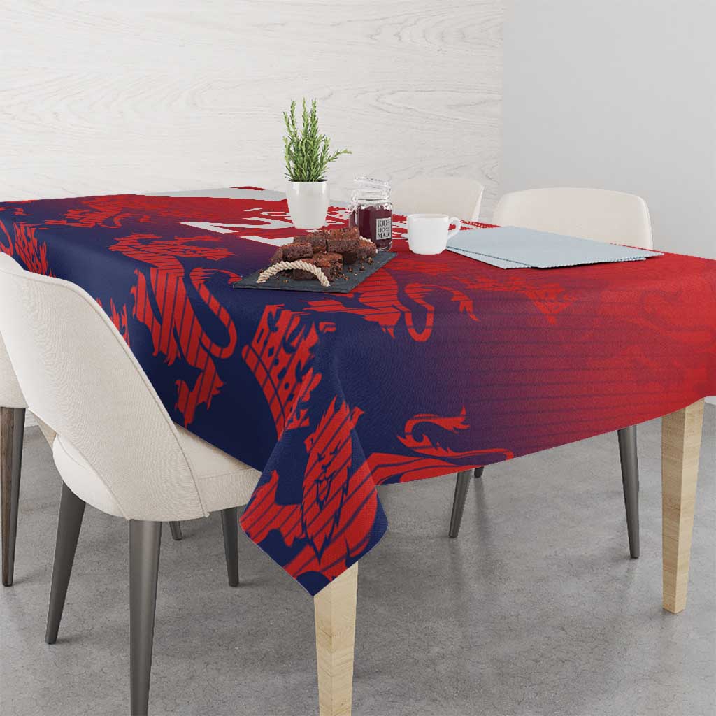 Red and navy lion crest cricket tablecloth draped over dining table
