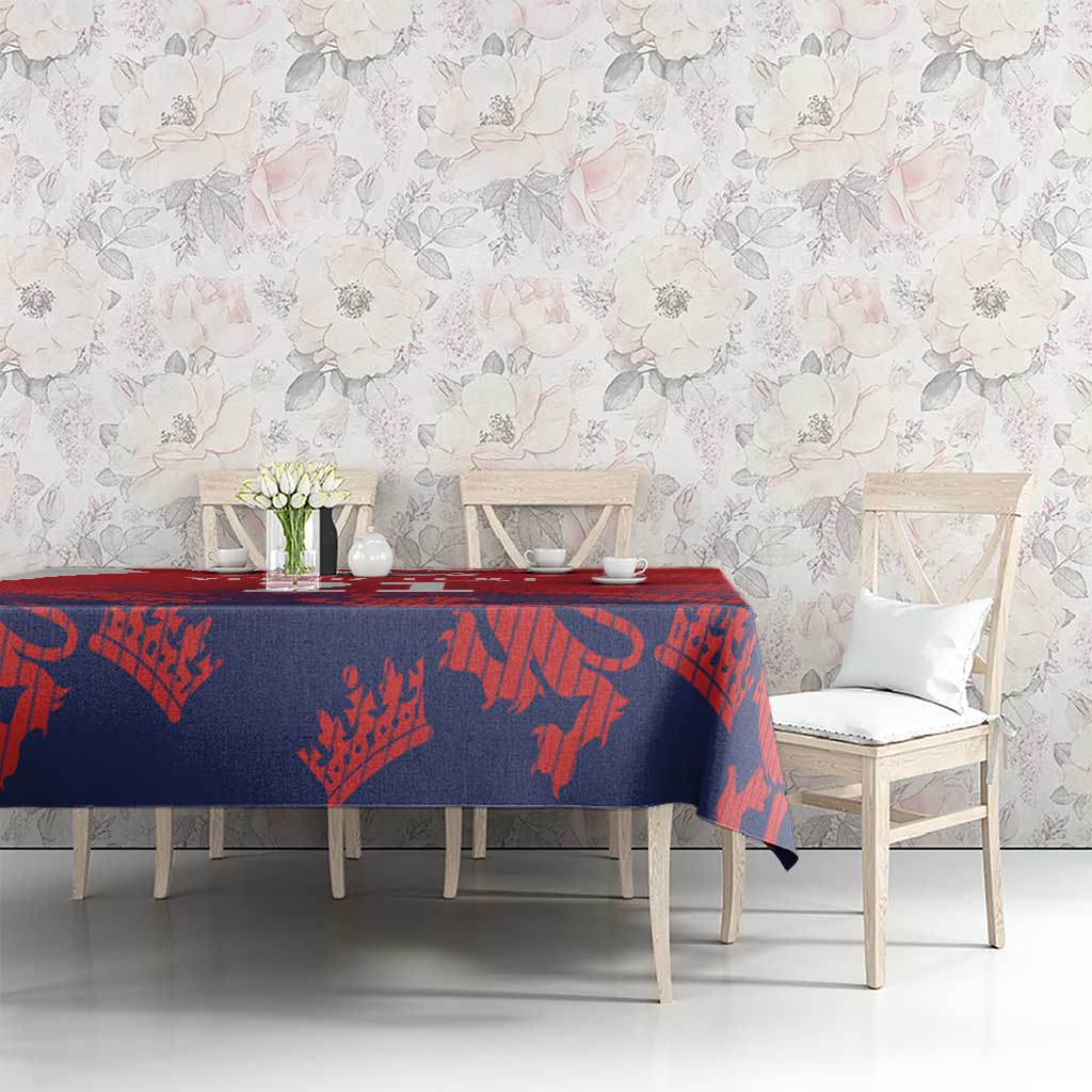 Red and navy cricket tablecloth with lion-and-flag pattern on dining table