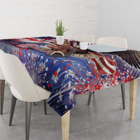 Patriotic tablecloth on a dining table with red stripes, blue stars, and fireworks