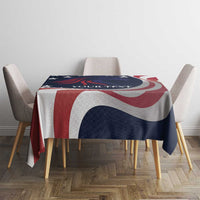 Patriotic tablecloth draped over table, navy with red and white curved stripe pattern