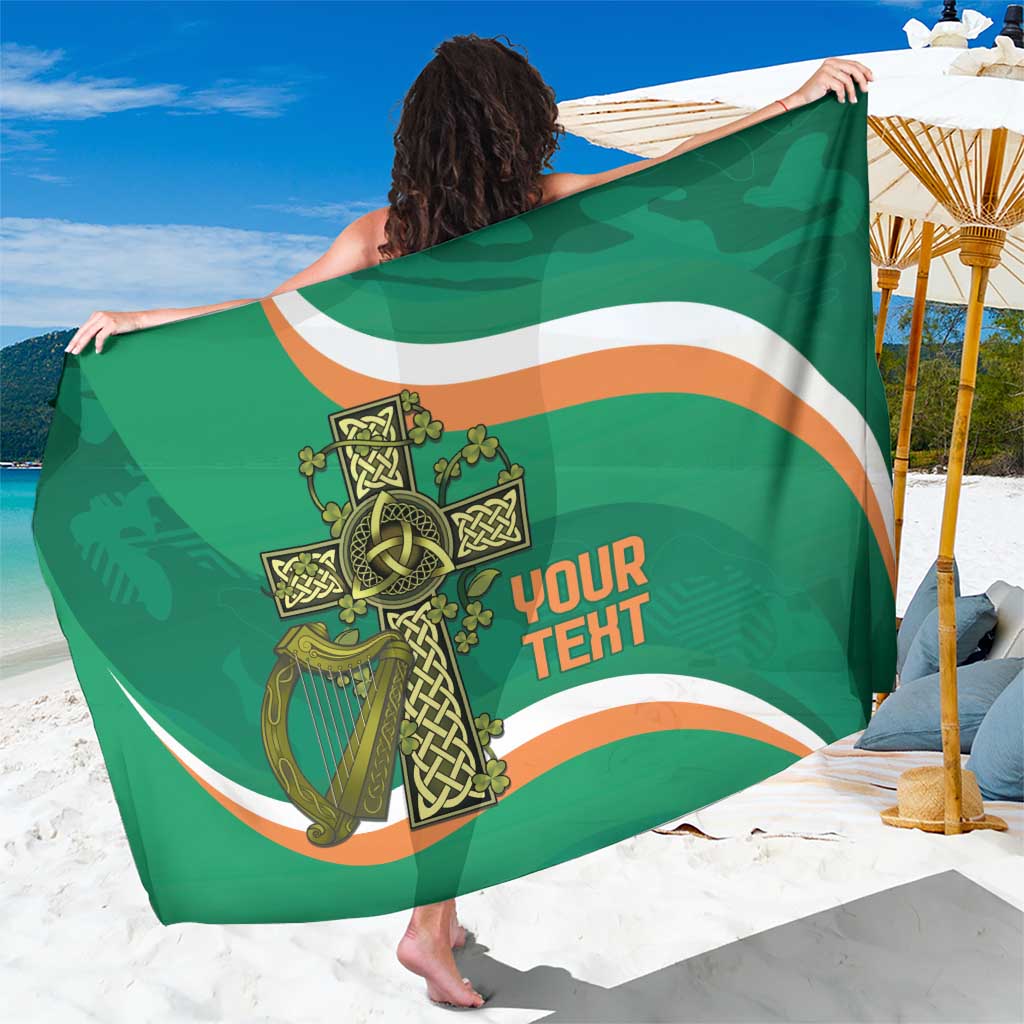 Green sarong draped with large Celtic crest and 'YOUR TEHT' text in gold