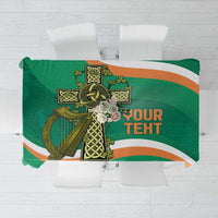 Green tablecloth with Celtic cross knotwork and orange-and-white stripes
