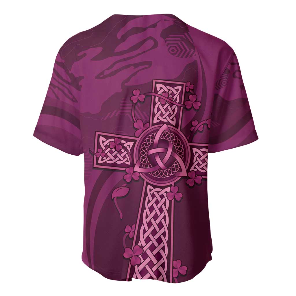 Maroon jersey with short sleeves, button placket, and centered Celtic knot and clover emblem