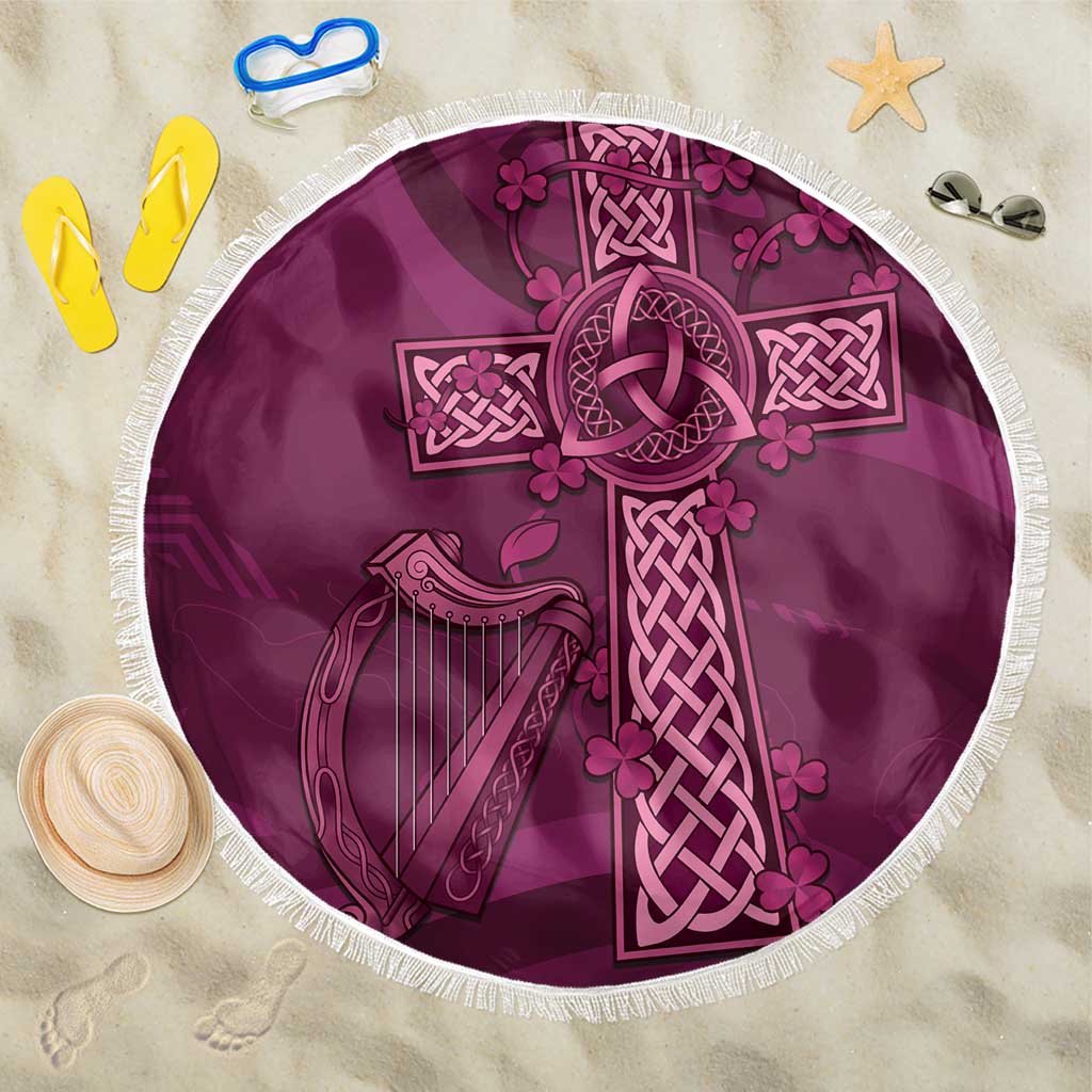 Maroon round beach blanket with white fringe and Celtic cross, knot, harp design