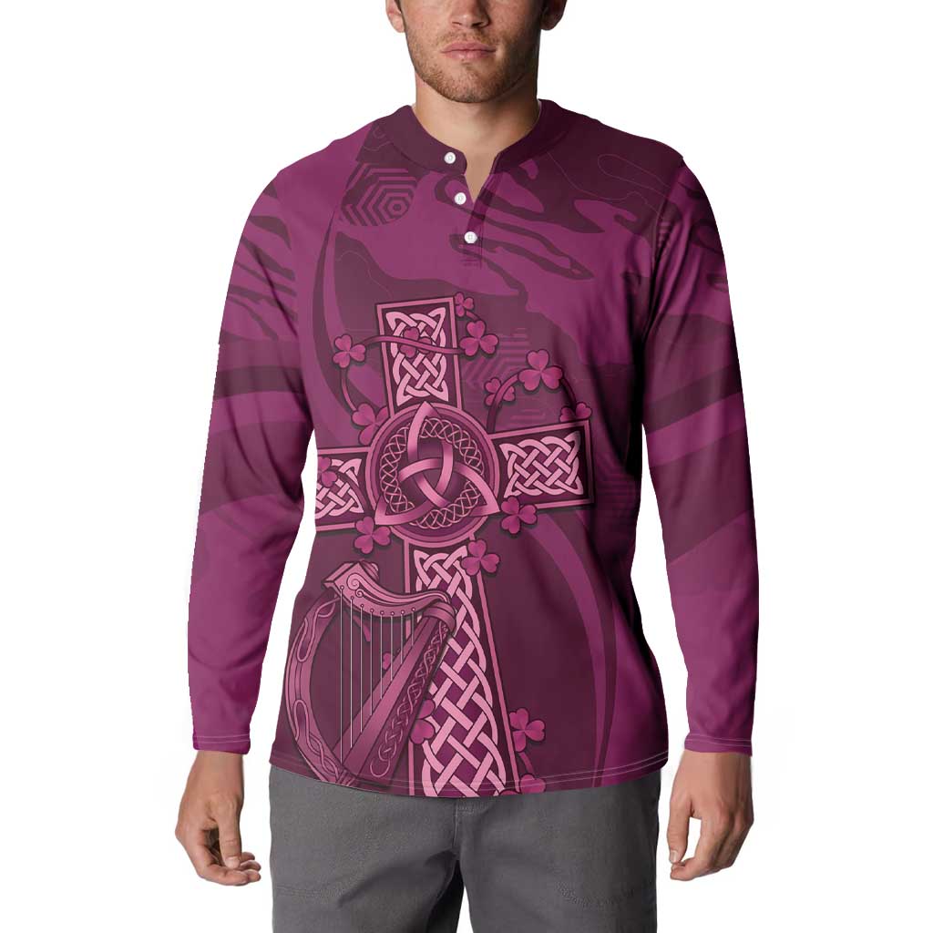 Maroon rugby button sweatshirt on model, long sleeves, buttoned collar and Celtic knot print