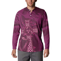 Maroon rugby button sweatshirt on model, long sleeves, buttoned collar and Celtic knot print