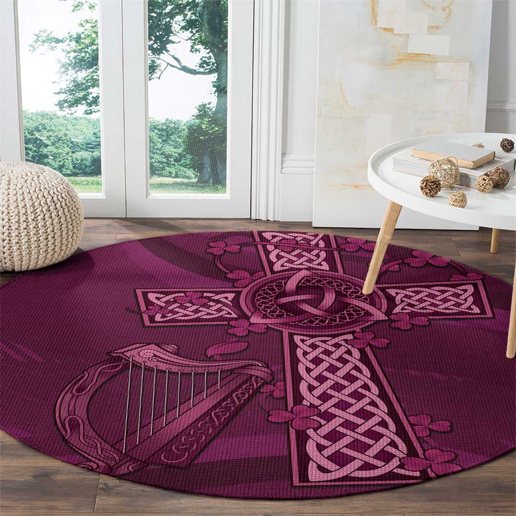 Maroon Celtic knot round rug with harp and clover-like accents